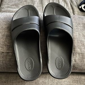 OOFOS BLACK SLIDES, like new, can’t remember ever wearing..